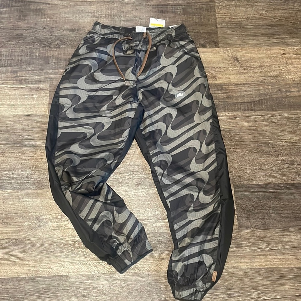 Nike sportswear grey pants smaller loose fit mid rise track pants